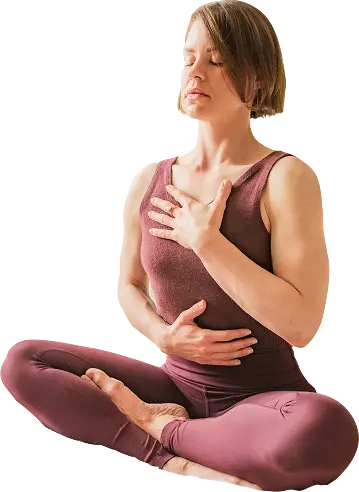 Conscious breathwork practice with a hand resting on the chest